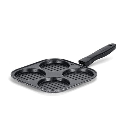 Black cast iron skillet with multiple cooking compartments on a white background