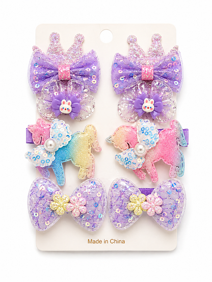 Set of colorful hair bows with unicorn designs on a white background