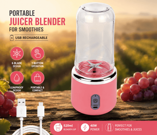 Pink portable juicer blender with features highlighted on a wooden surface with grapes in the background.